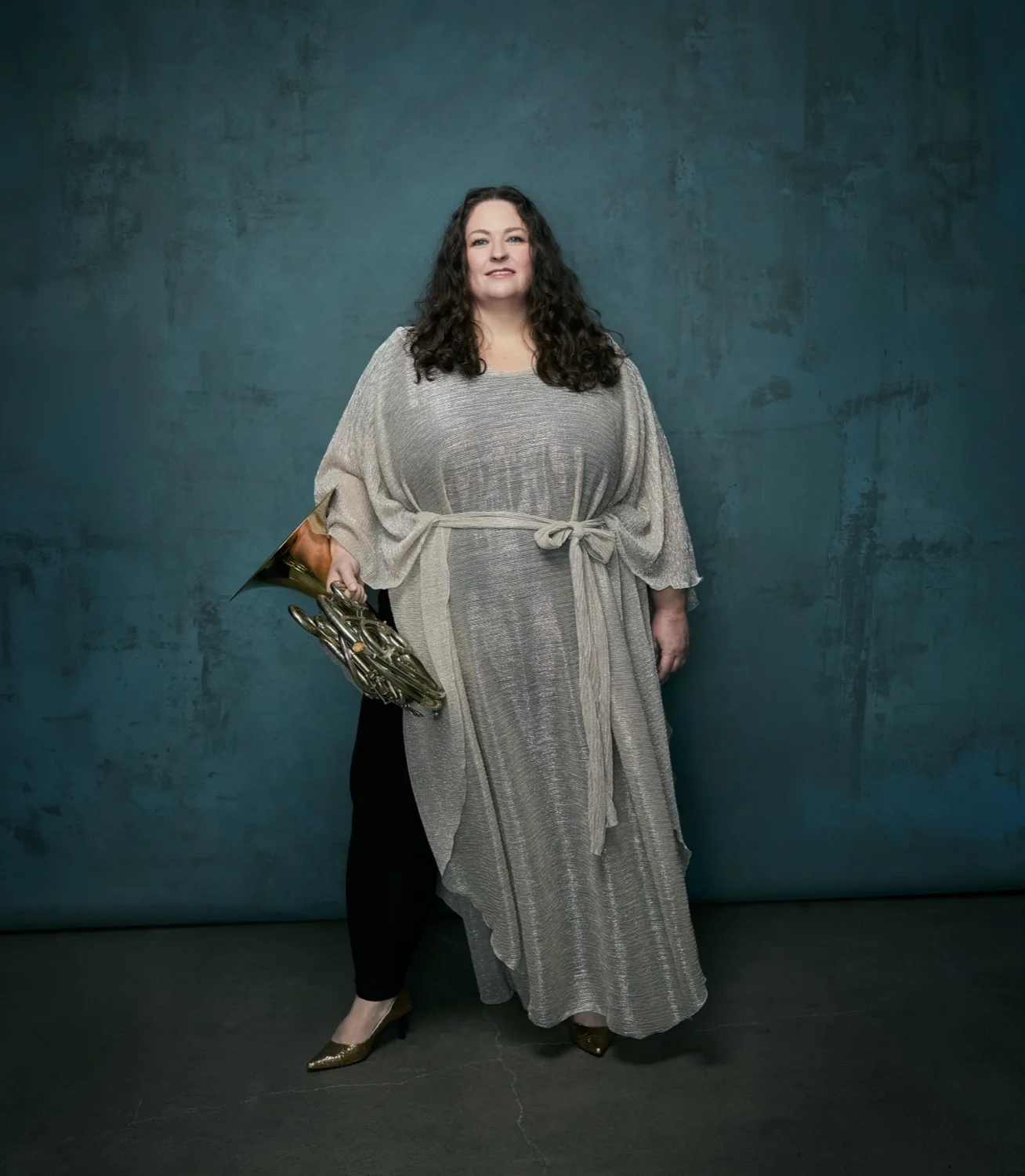 Megan Cullen standing with her horn